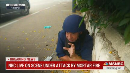 Richard Engel takes cover while reporting live from Sderot, Israel.