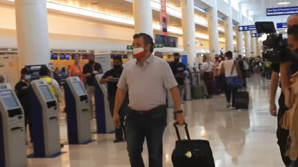 In this image from video, Sen. Ted Cruz, R-Texas, walks to check in for his flight back to the U.S., at Cancun International Airport in Cancun, Mexico, Thursday, Feb. 18, 2021.