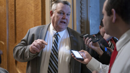 Sen. Jon Tester, D-Mont., speaks with reporters about the border security talks, outside the chamber at the Capitol in Washington, Thursday, Jan. 25, 2024. Any bipartisan border deal could be doomed because of resistance from former President Donald Trump.