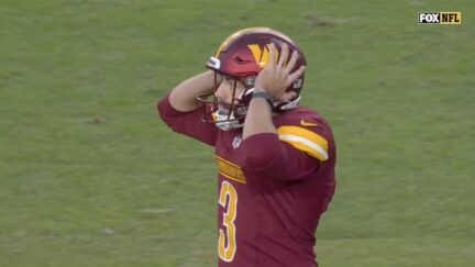 Washington Commanders kicker Austin Seibert reacts to missed extra point